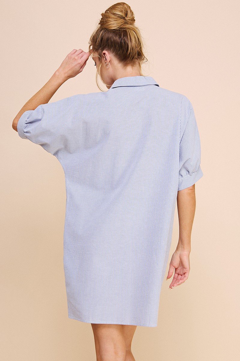 Woman wearing MARY FRANCES DRESS in light blue, perfect for summer outfits Texas at Raggdoll Boutique.