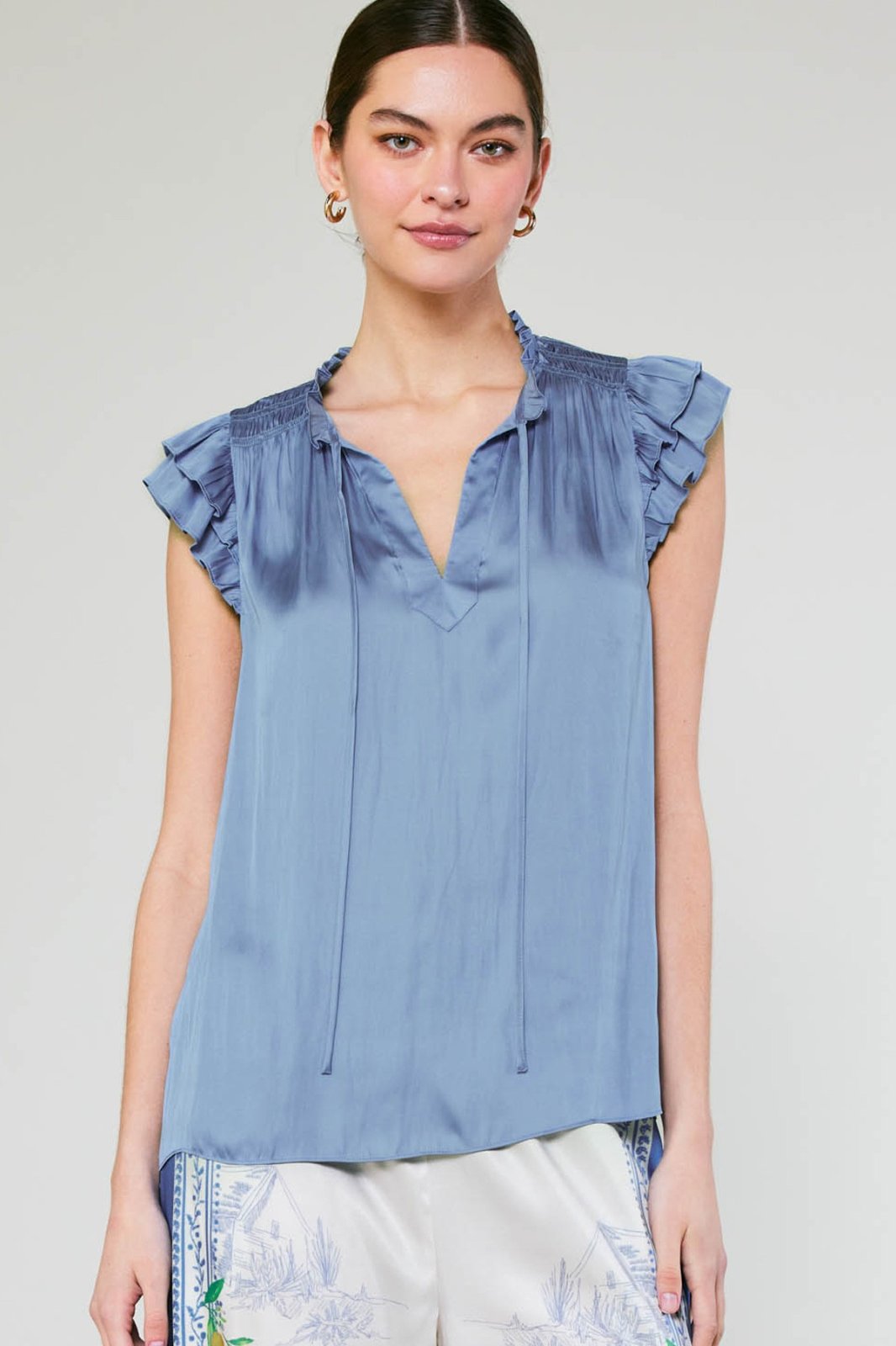 Celine Top in blue, stylish ruffled blouse perfect for coastal boutique clothing and Port Aransas beach dresses.
