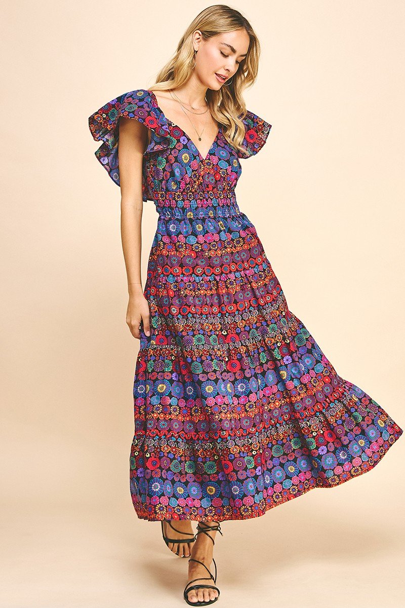 Happy Flowers Dress w/Open-Back Detail modeled in a colorful floral print, perfect for summer outfits Texas at Raggdoll Boutique.