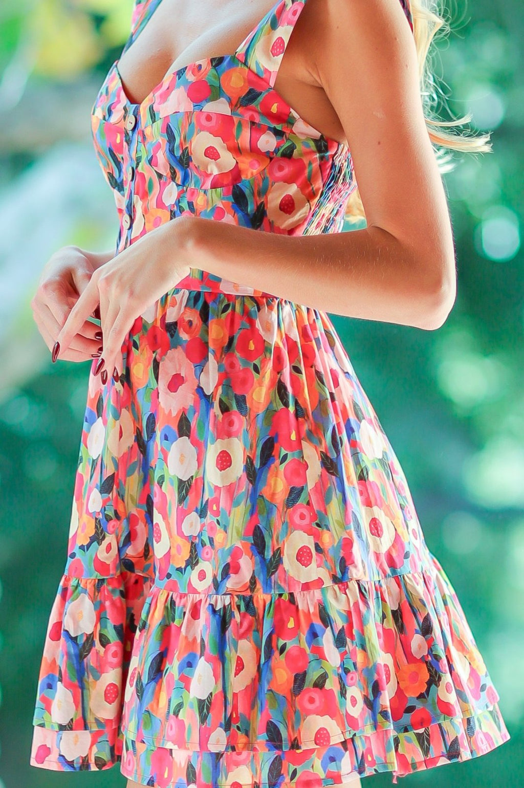 Flirty floral dress perfect for beach days, featuring vibrant colors. Ideal for coastal boutiques and curvy plus size fashion.