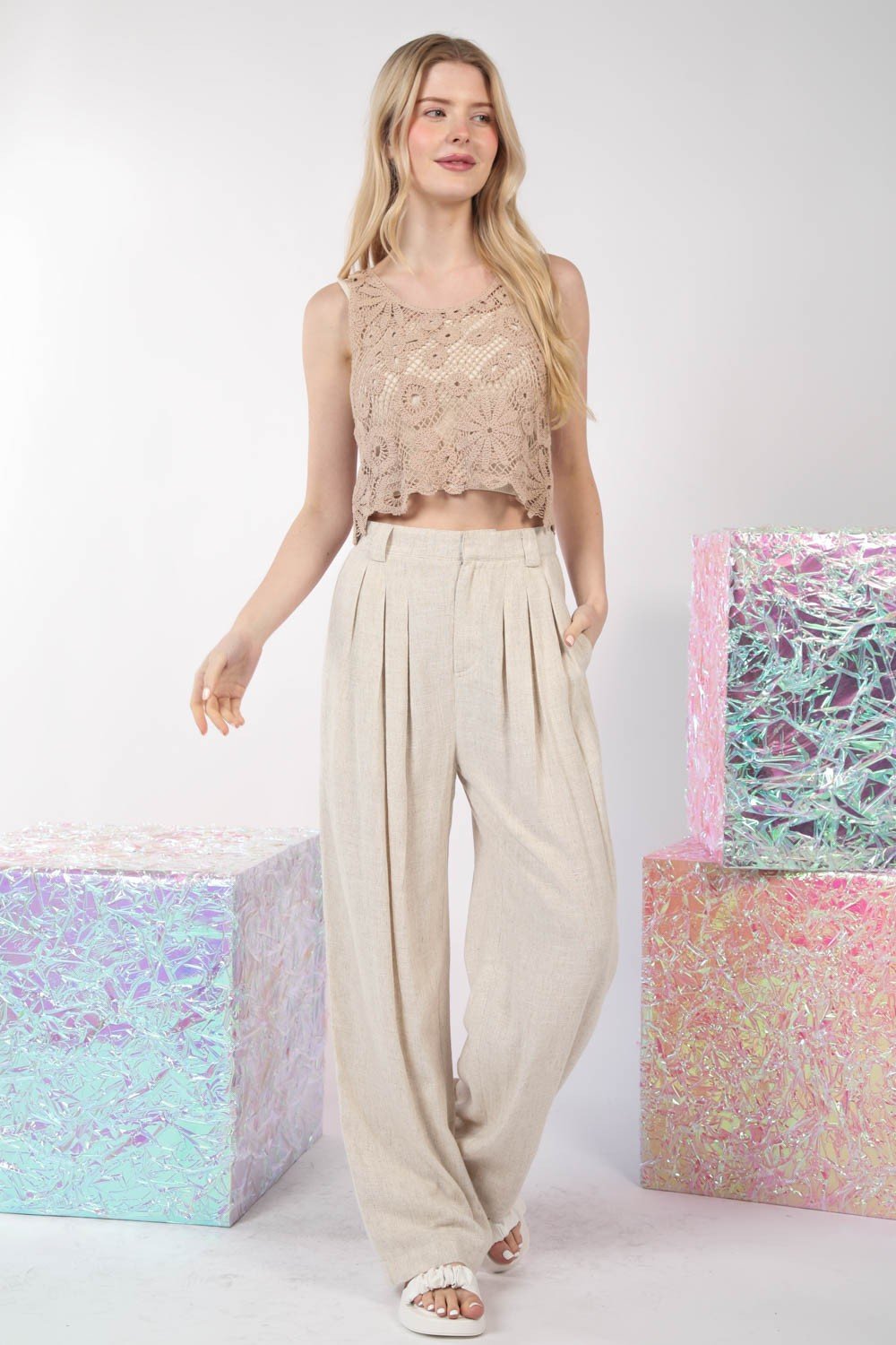 TAUPE FLORAL CROCHET CROPTANK TOP styled with wide-leg pants at Raggdoll Boutique, perfect for coastal fashion.