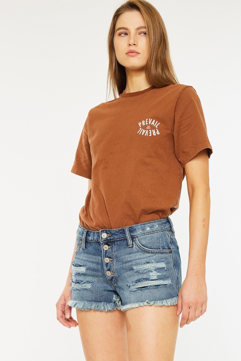Kancan mid-rise jean shorts paired with a stylish graphic tee, perfect for summer outings and casual wear. Curated women's fashion.