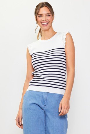 WHITE-NAVY KNIT TOP (SWEATER) worn by a smiling model, perfect for trendy coastal style at Raggdoll Boutique.