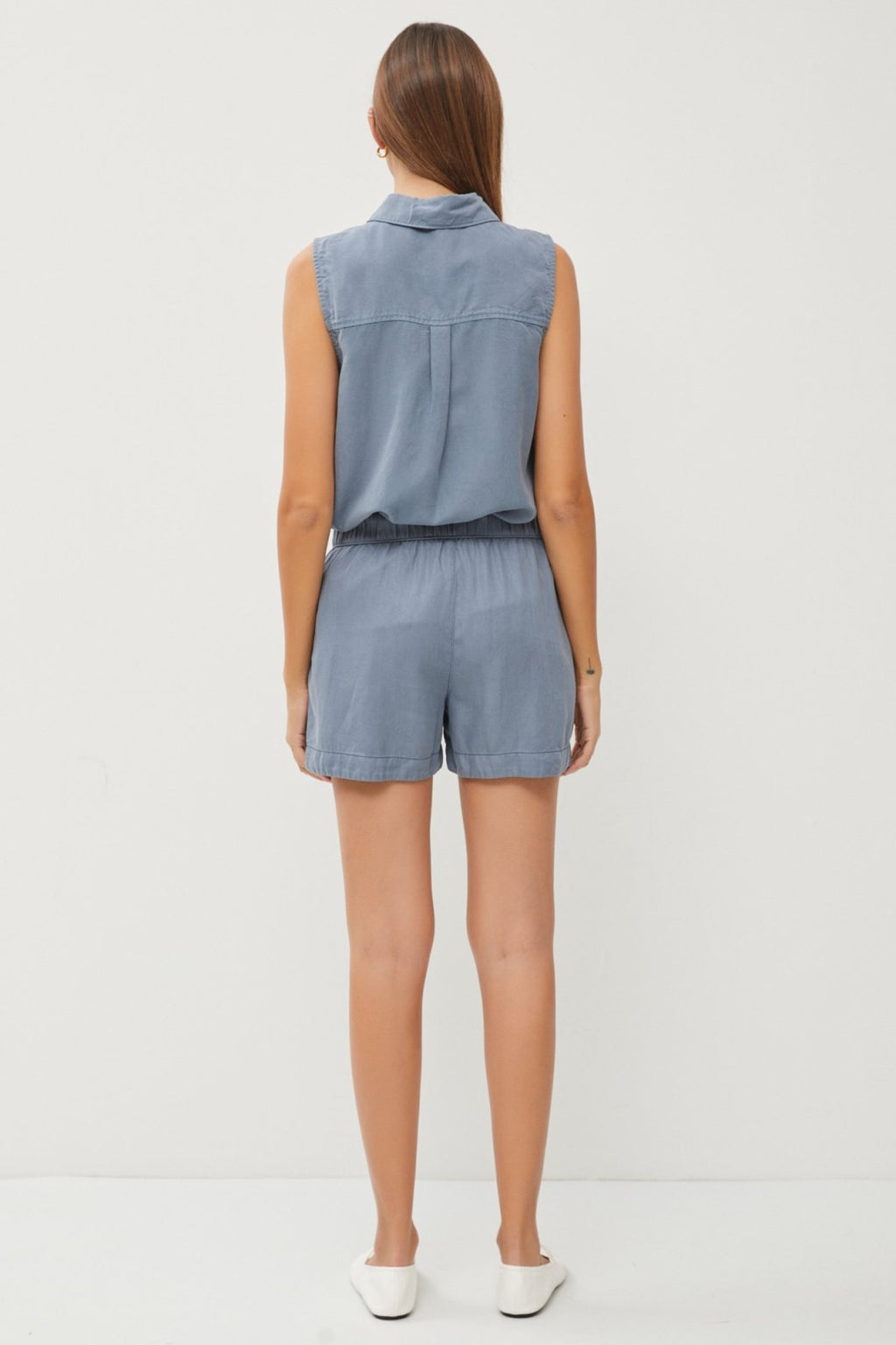 Woman wearing Slate Blue Tencel Shorts, showcasing trendy coastal style from Raggdoll Boutique.
