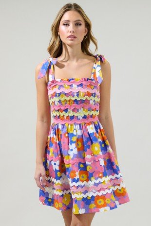Happy Days Dress from Raggdoll Boutique featuring bright floral patterns and self-tie straps, perfect for summer outfits Texas.