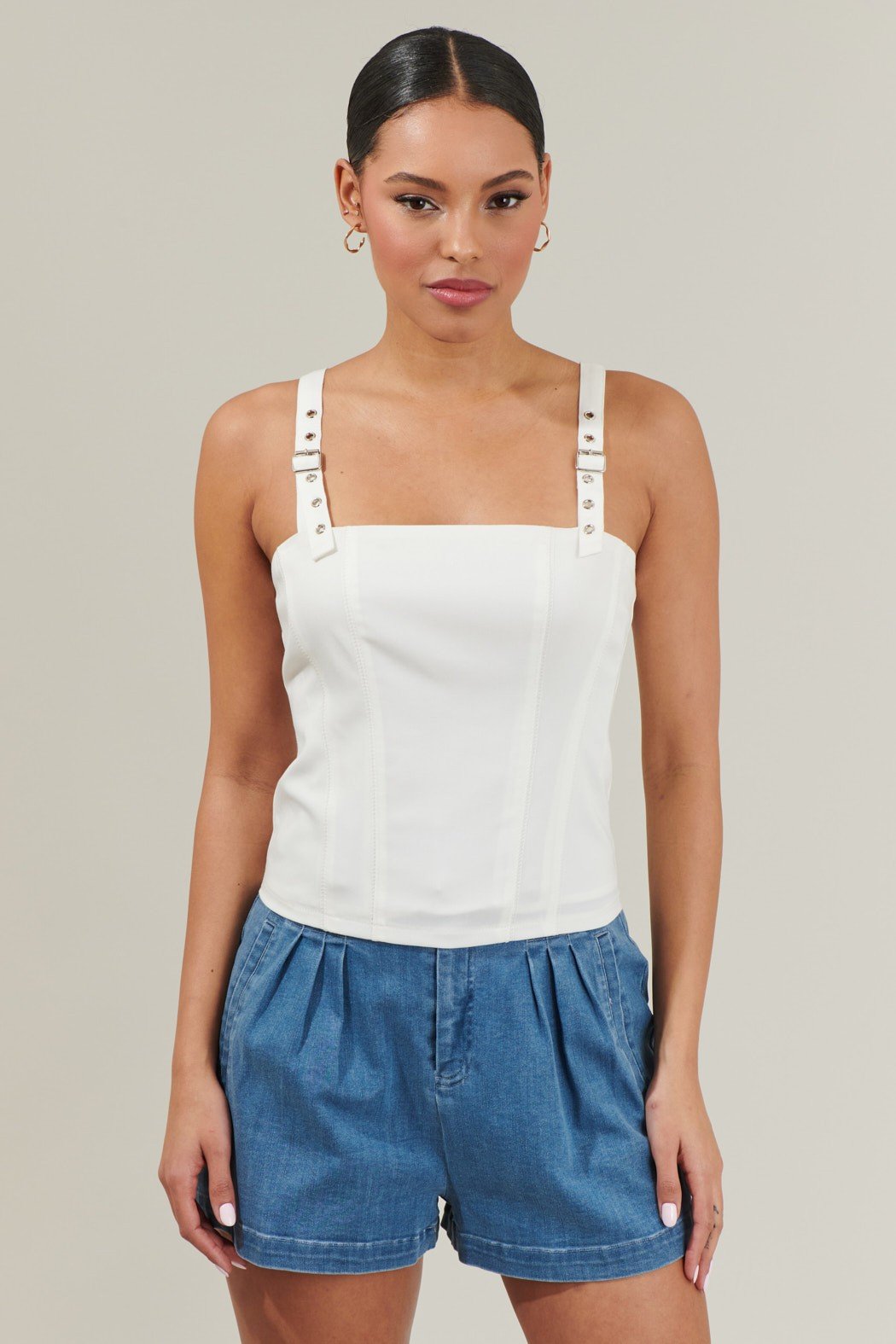 Haille Bustier Top featuring belt buckle shoulder straps, perfect for trendy coastal style from Raggdoll Boutique.
