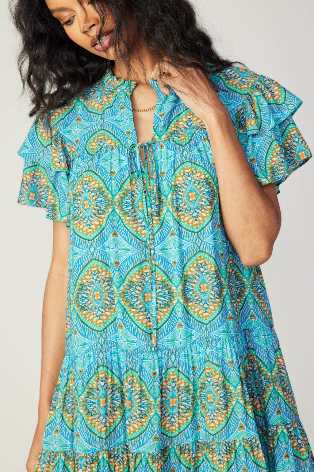 Lydia Dress featuring vibrant blue patterns, perfect for trendy coastal style from Raggdoll Boutique in Port Aransas.