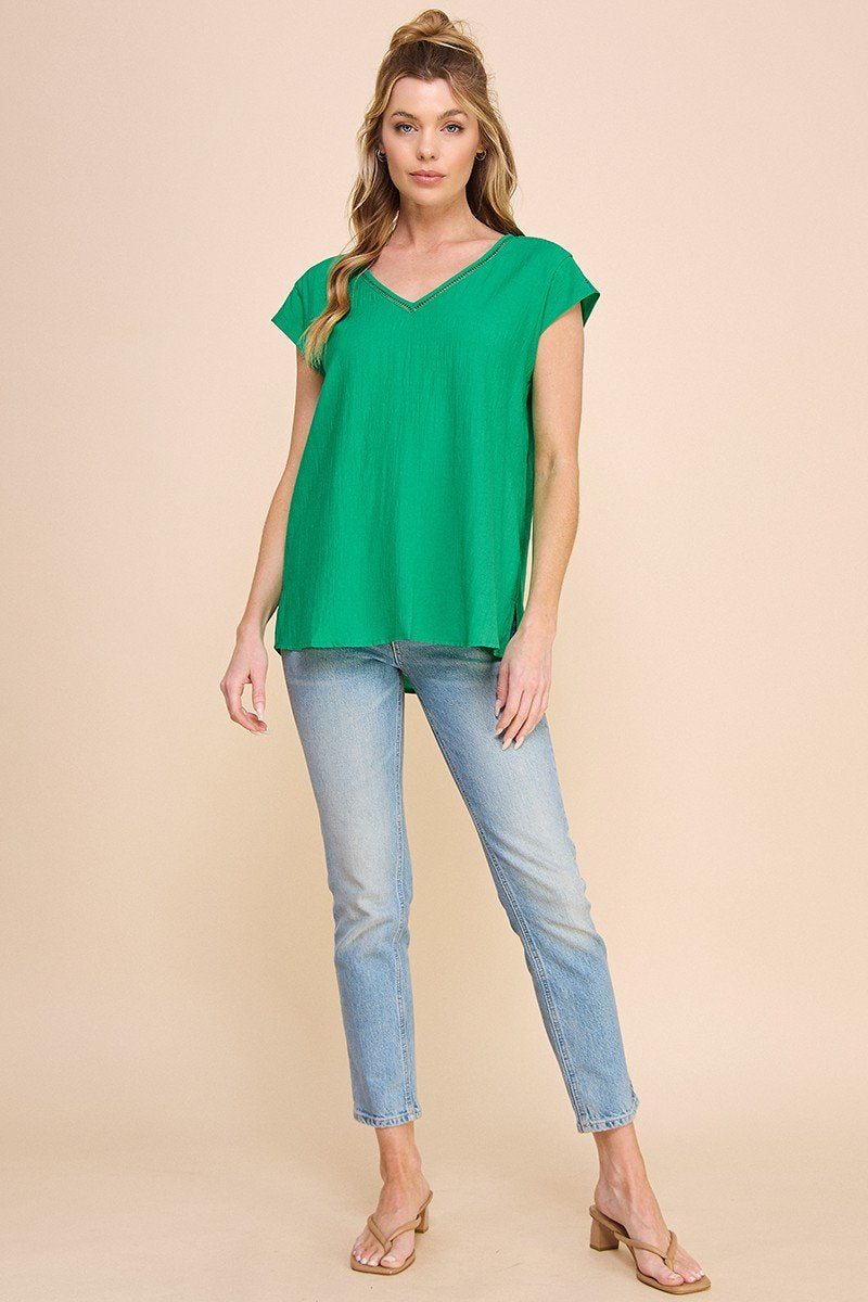 Kelly Green Textured Top worn with jeans, ideal for summer outfits Texas from Raggdoll Boutique.