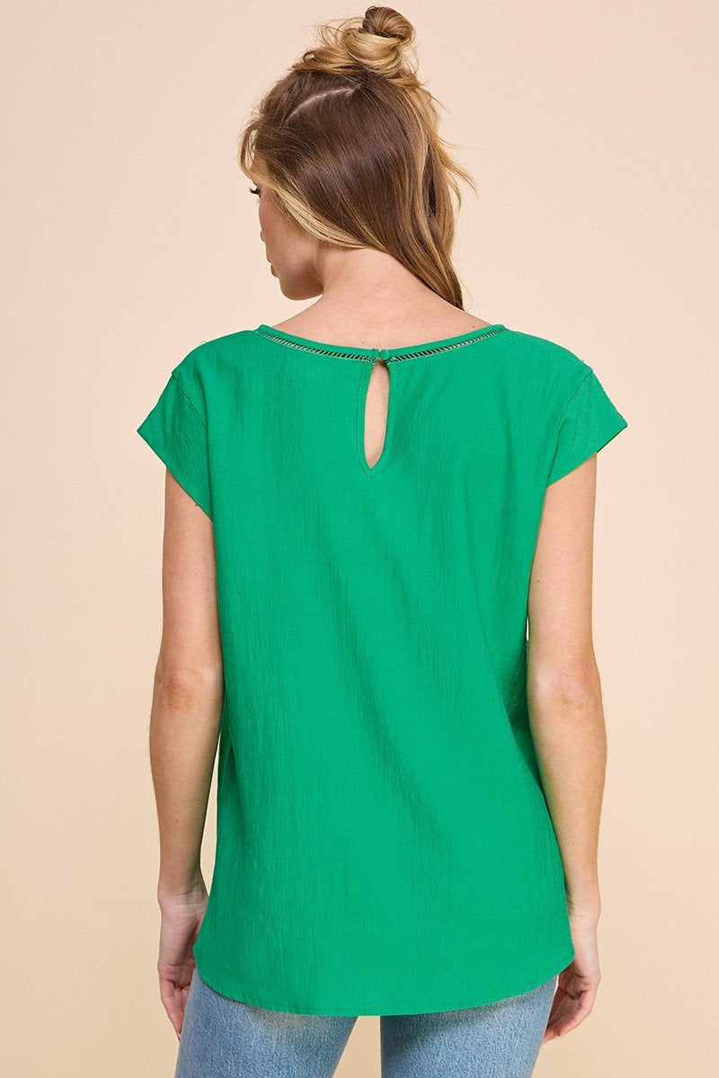 Back view of KELLY GREEN TEXTURED TOP showcasing stylish design. Perfect for summer outfits Texas from Raggdoll Boutique.