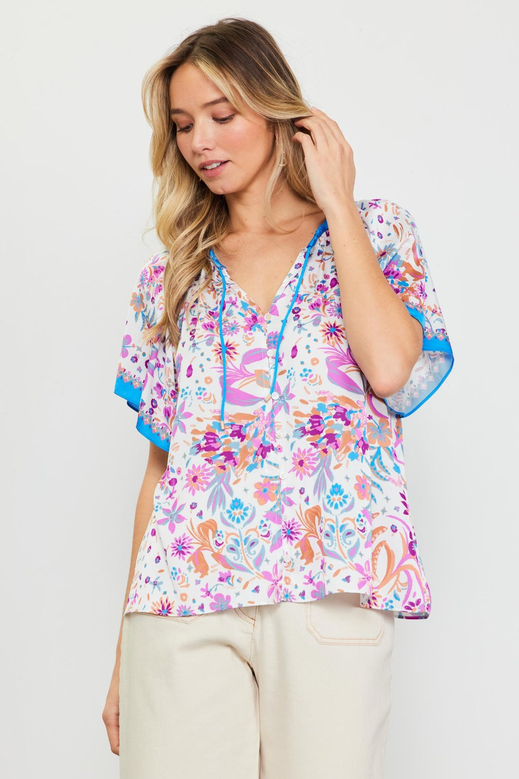 Capri Top from Raggdoll Boutique featuring tie neck and floral print, perfect for summer outfits Texas.