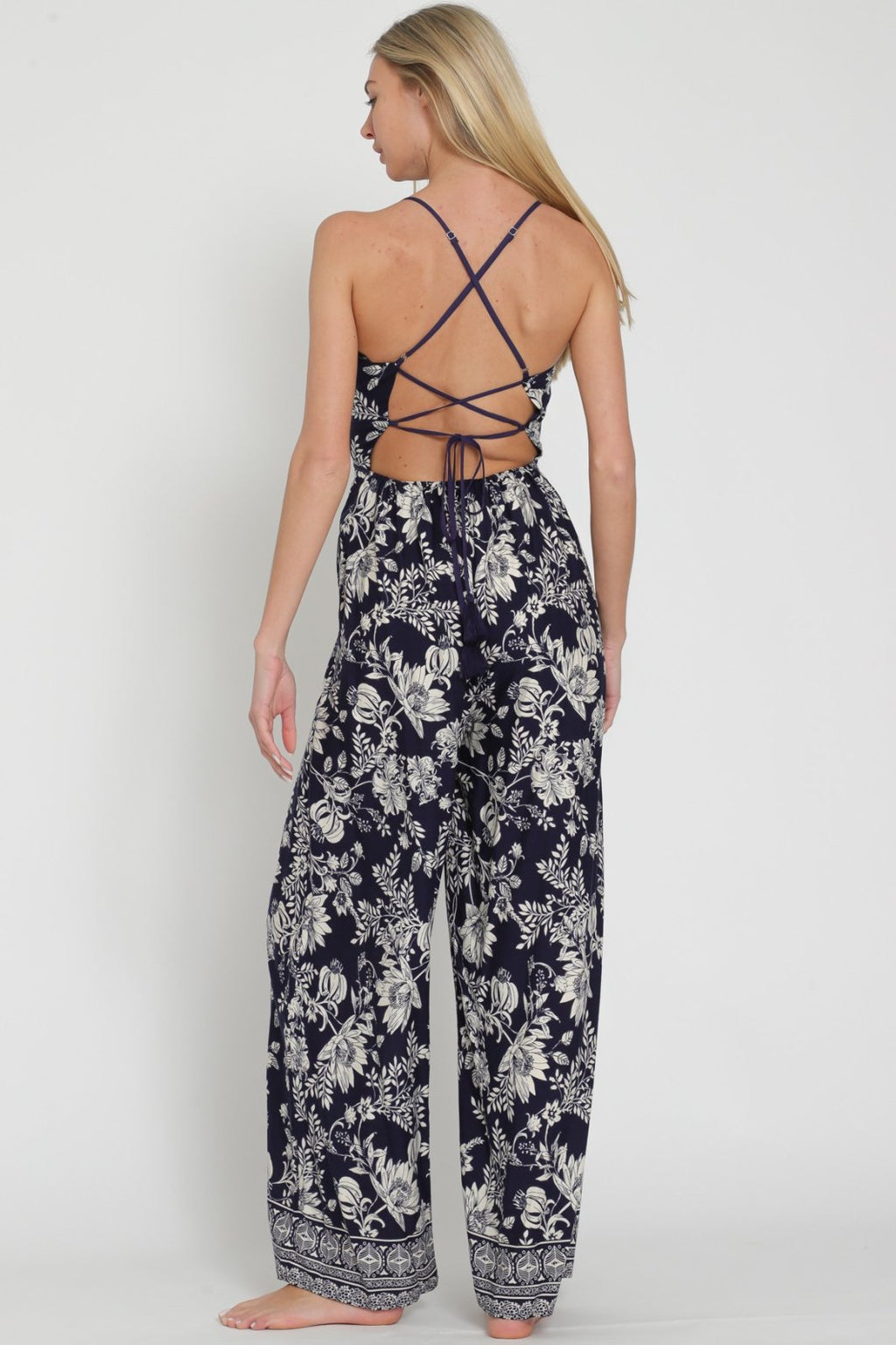 Back view of Natalie Jumpsuit from Raggdoll Boutique, perfect for summer outfits and coastal fashion.