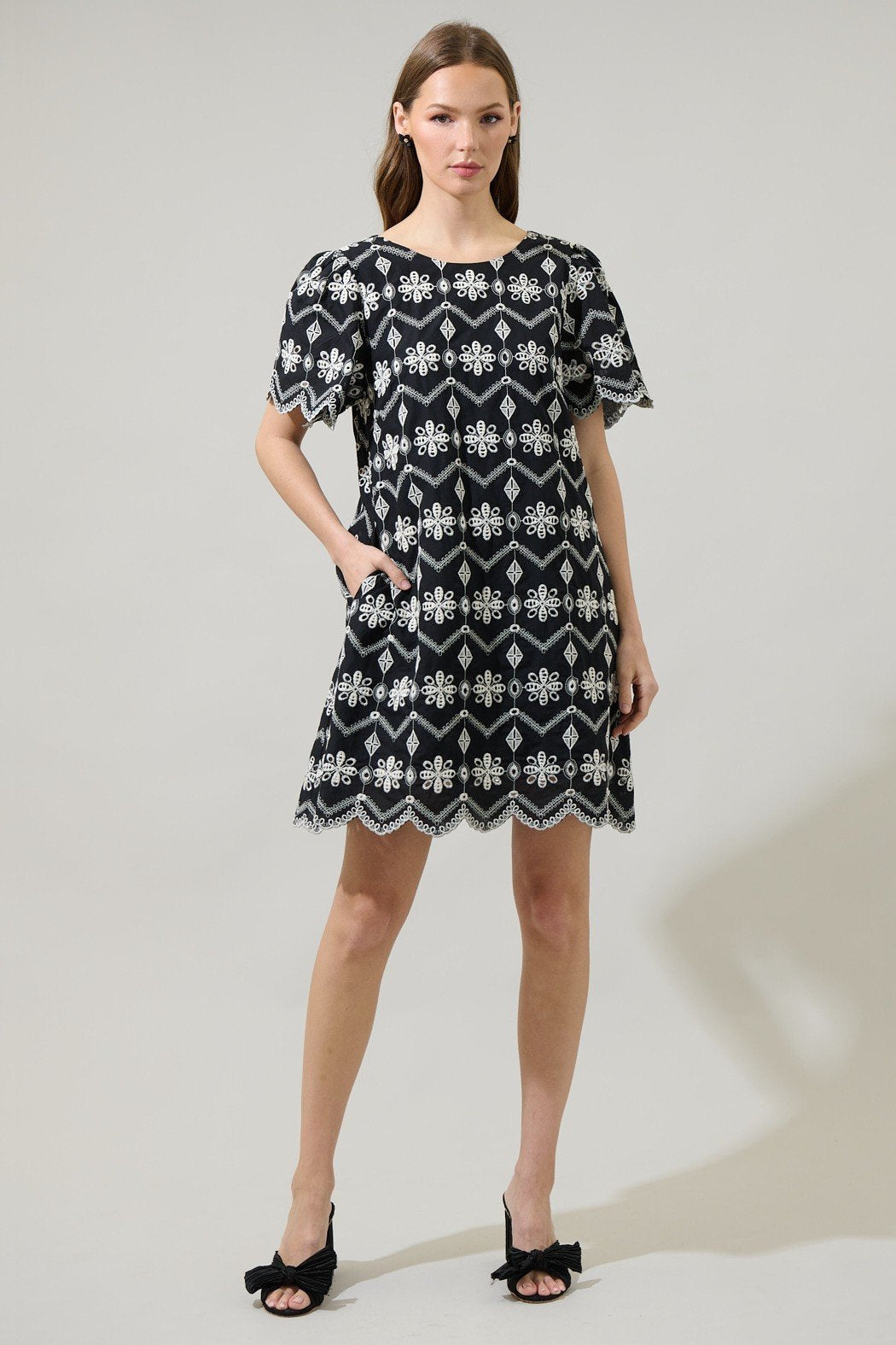 Model wearing the Libby Dress, a trendy coastal style dress available at Raggdoll Boutique, perfect for the summer wardrobe.