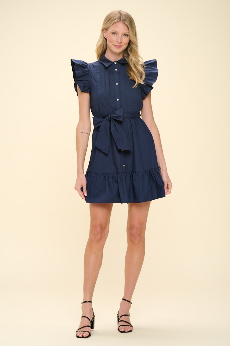 Louisa Dress: Stylish beach dress with ruffled sleeves, perfect for coastal boutiques and tropical vacations.