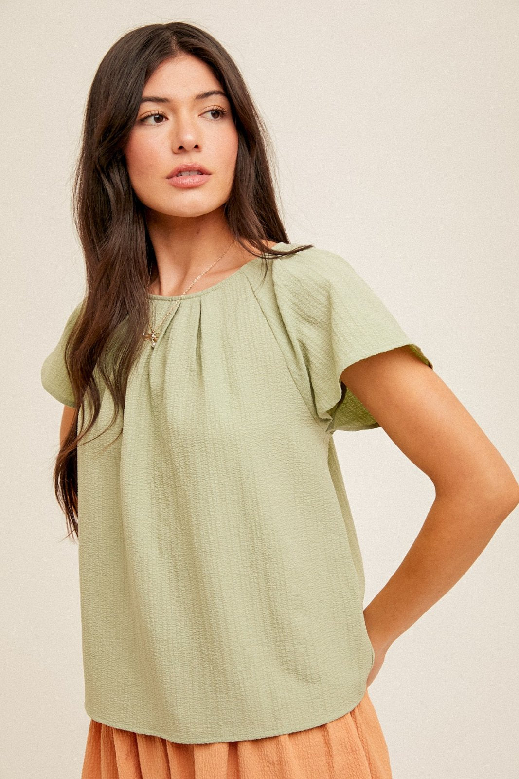 Sage Top in light green, a trendy coastal style from Raggdoll Boutique, perfect for summer outfits in Texas.