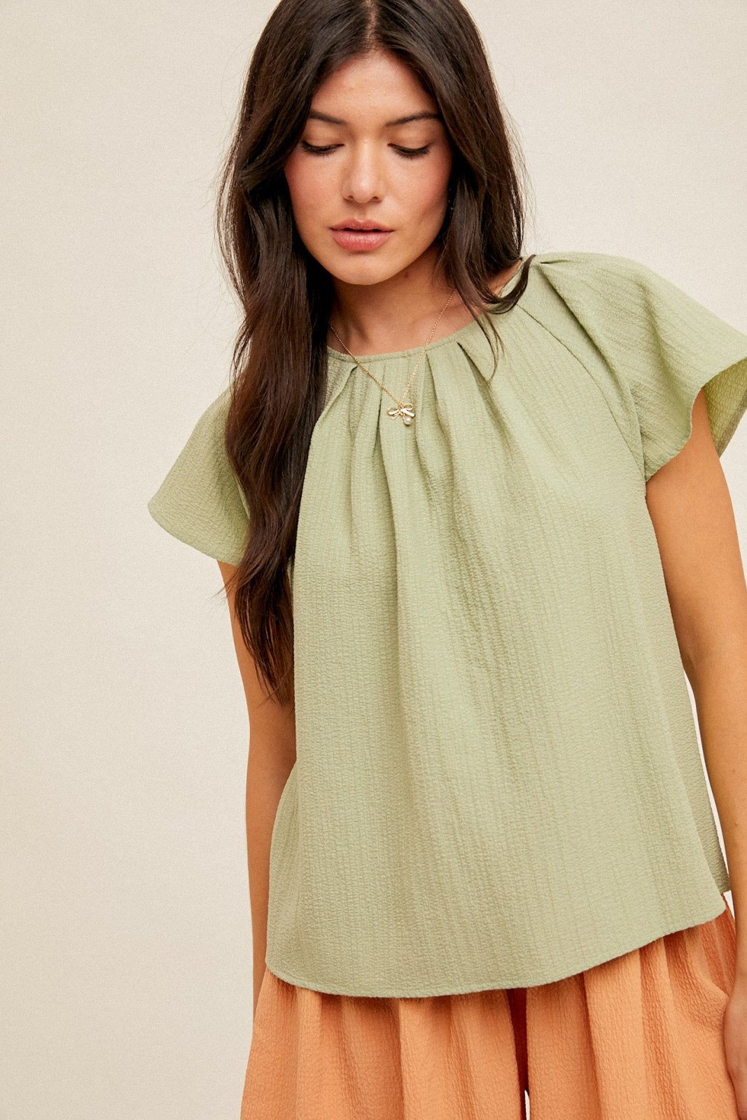 Sage Top from Raggdoll Boutique, trendy coastal style top perfect for summer outfits Texas and vacation wardrobe boutique.