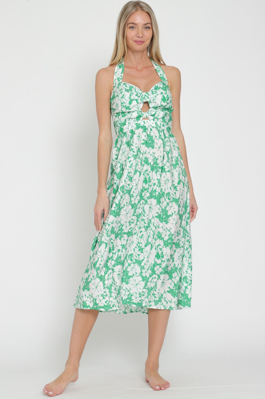 Debbie Dress from Raggdoll Boutique, perfect for summer outfits in Port Aransas, embodies trendy coastal style.
