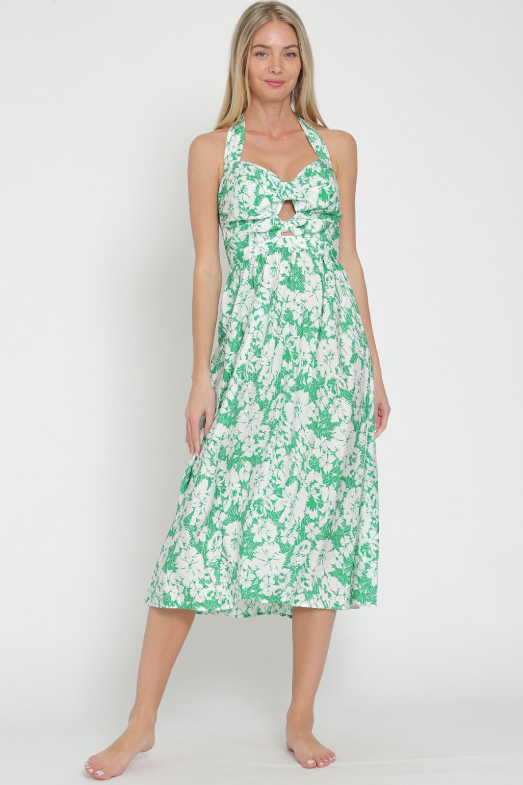 Debbie Dress from Raggdoll Boutique, perfect for summer outfits in Port Aransas, embodies trendy coastal style.