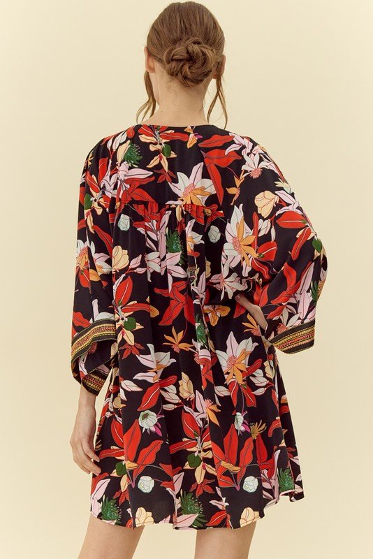 Stylish Paula Dress with floral pattern, perfect for coastal boutique clothing and tropical vacations, ideal for curvy women.
