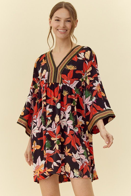Stylish Paula Dress featuring vibrant floral design, perfect for beach outings; ideal for curvy plus size fashion and tropical vacations.
