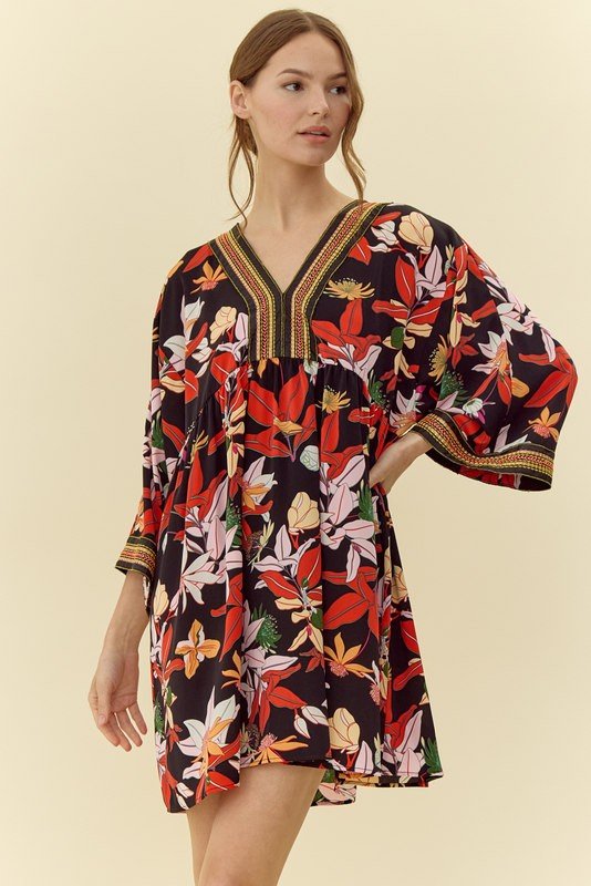 Paula Dress in vibrant floral print, perfect for coastal boutique clothing and tropical vacations. Curated women's fashion.