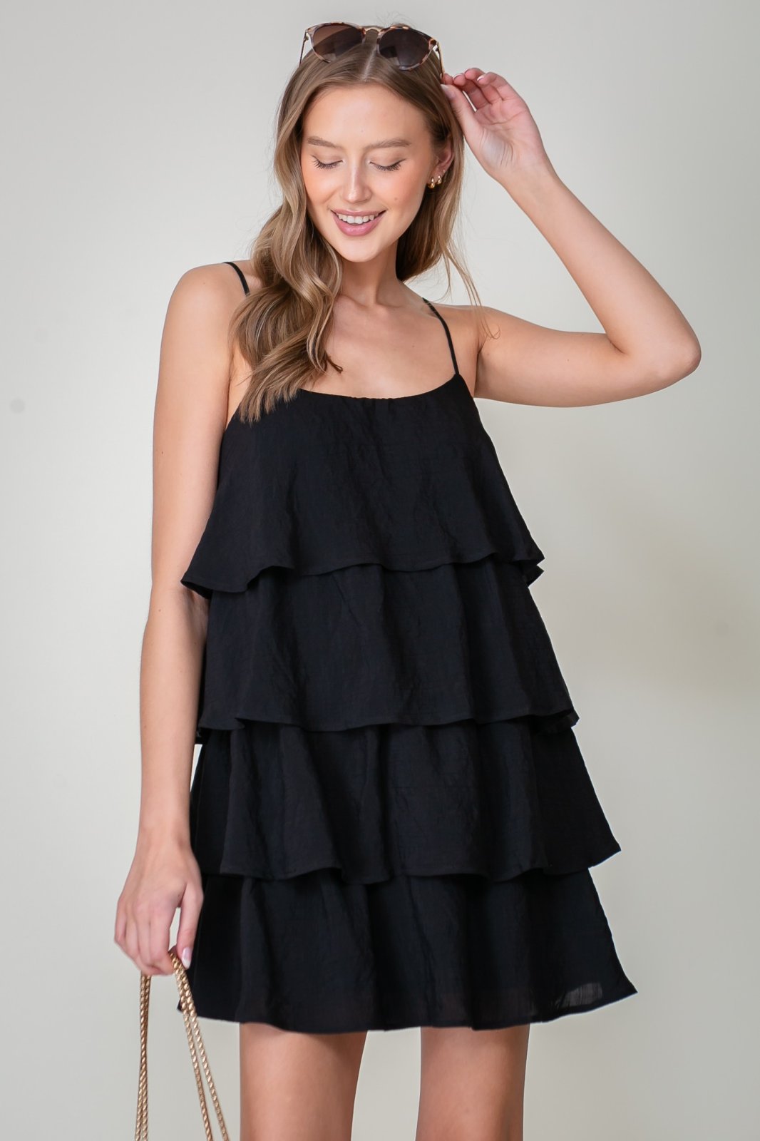 Lulu Dress from Raggdoll Boutique showcases a sleeveless tiered silhouette, perfect for summer outfits Texas.