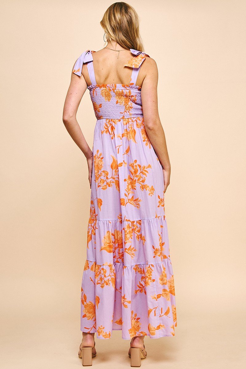 Evelyn Dress back view featuring floral tiered maxi design with tie shoulder straps, from Raggdoll Boutique.