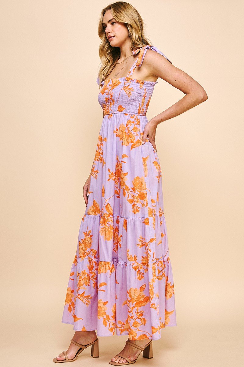 Evelyn Dress: Floral tiered maxi dress with tie straps and smocked bodice from Raggdoll Boutique, perfect for summer outfits.