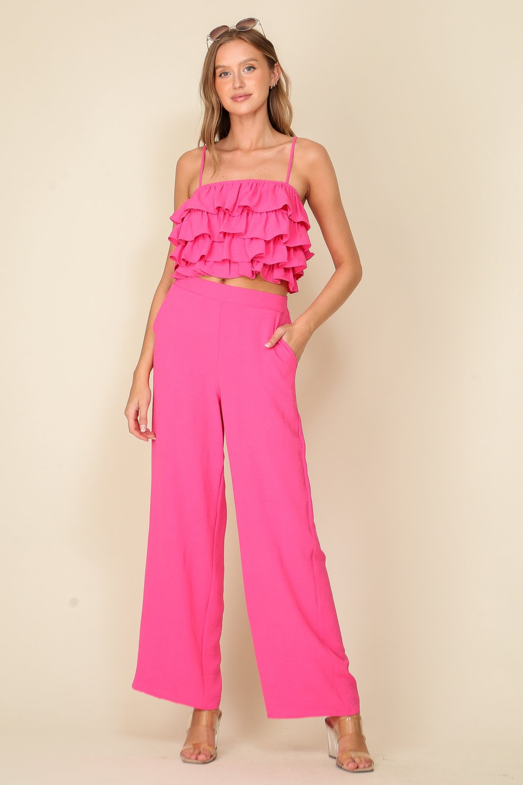 Bridgette 2Piece Set from Raggdoll Boutique, featuring a sleeveless crop top and matching pants in vibrant pink.