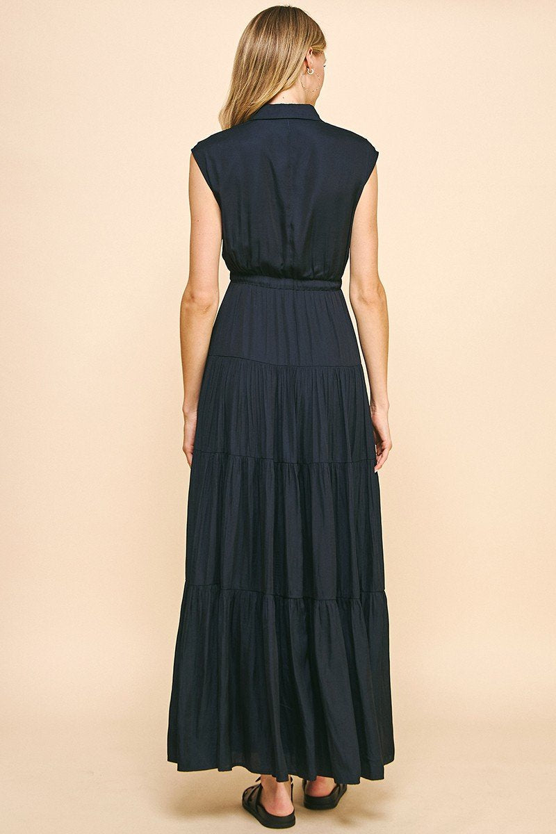 Navy-ink maxi dress with a tiered design, perfect for coastal boutique clothing and a night out.