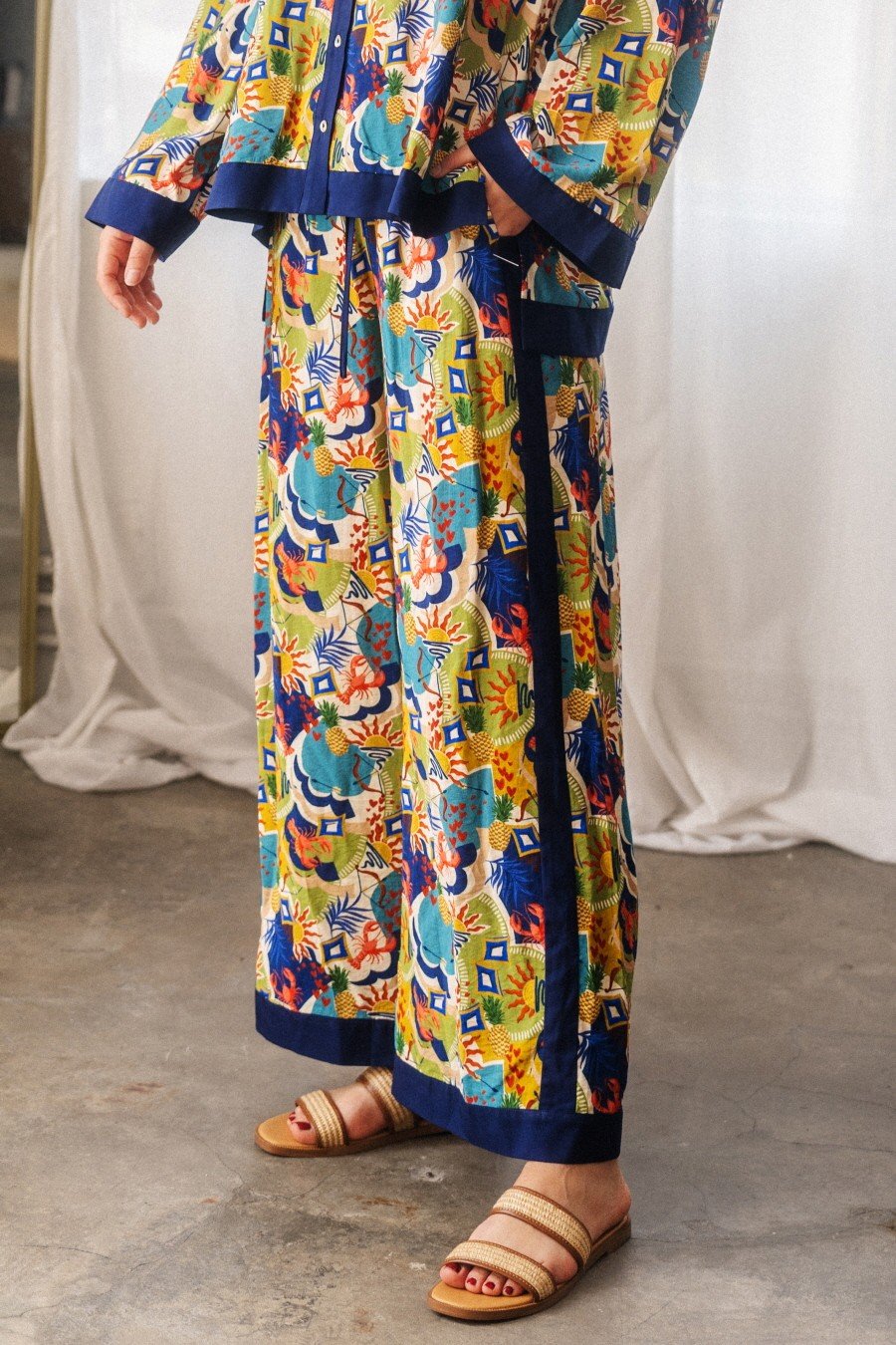 Vibrant POPPY PALAZZO PANTS with tropical print, ideal for Port Aransas boutique style and coastal boutique clothing.