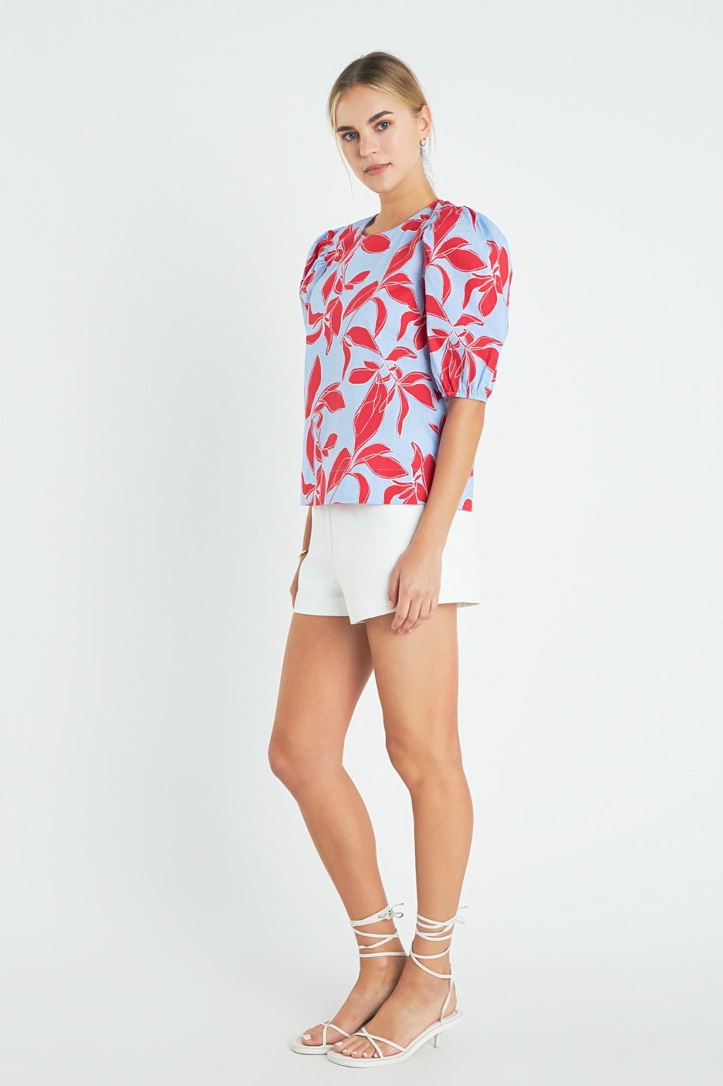 Model wearing a Blue, Red Puff Sleeve top from Raggdoll Boutique, showcasing trendy coastal style.