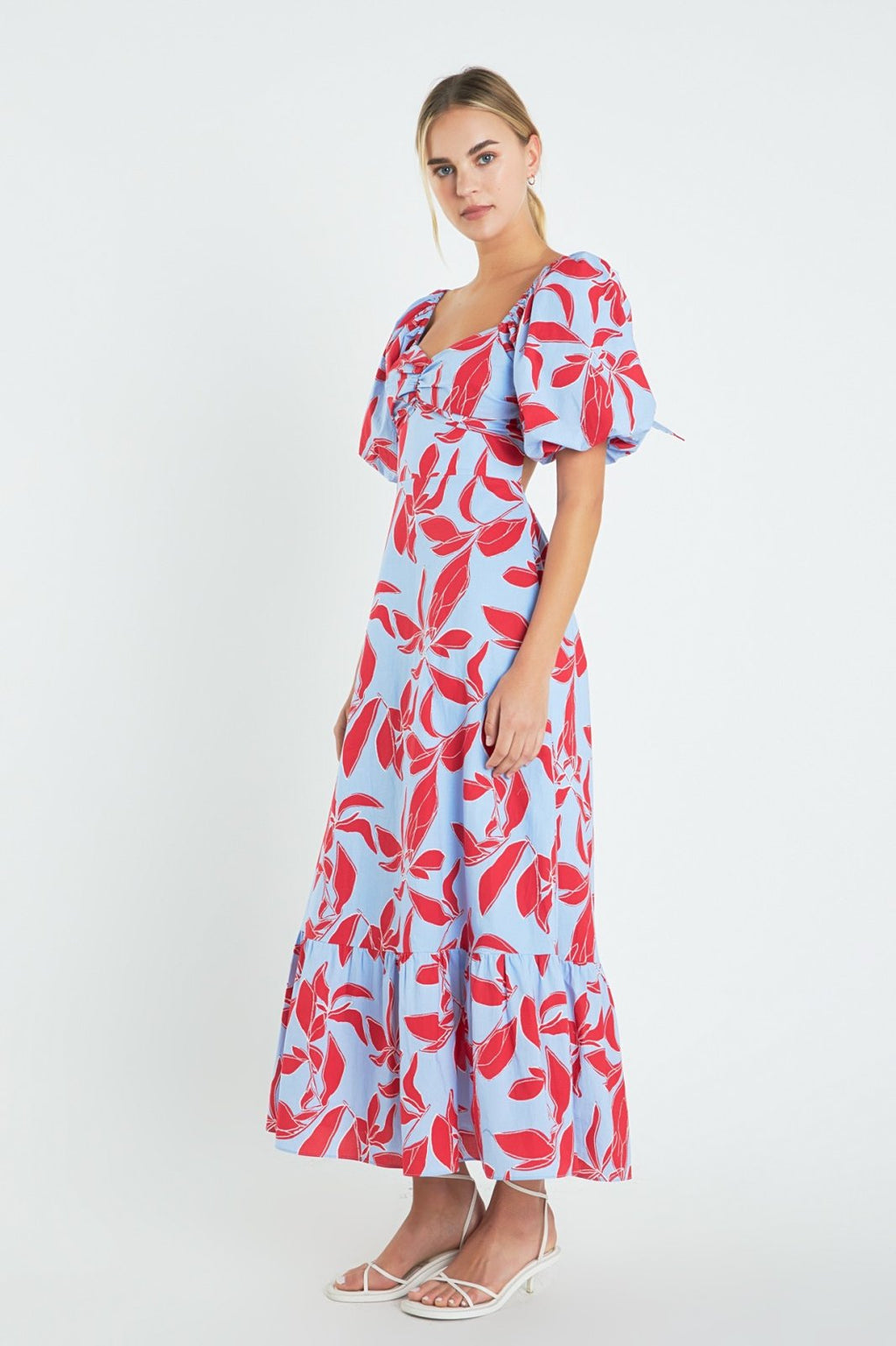 Model wearing a blue and red floral Perfect Brunch Dress from a Port Aransas boutique, ideal for beach outings and tropical vacations.