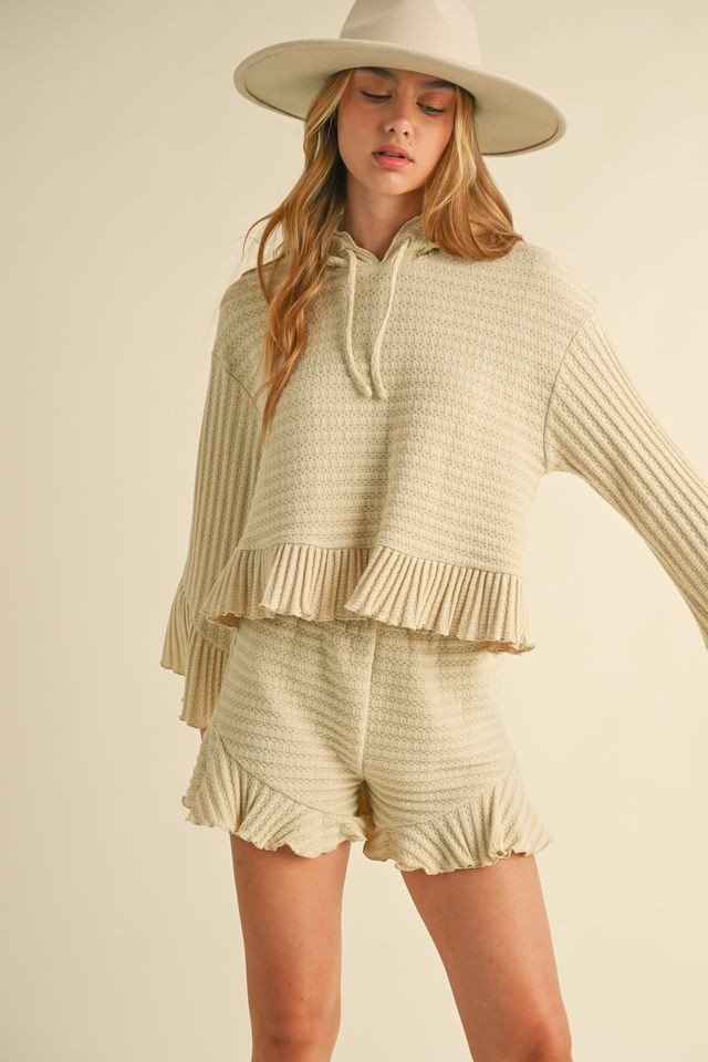 Hooded long sleeve top with ruffle shorts, perfect for beach outings, from Port Aransas coastal boutique clothing.