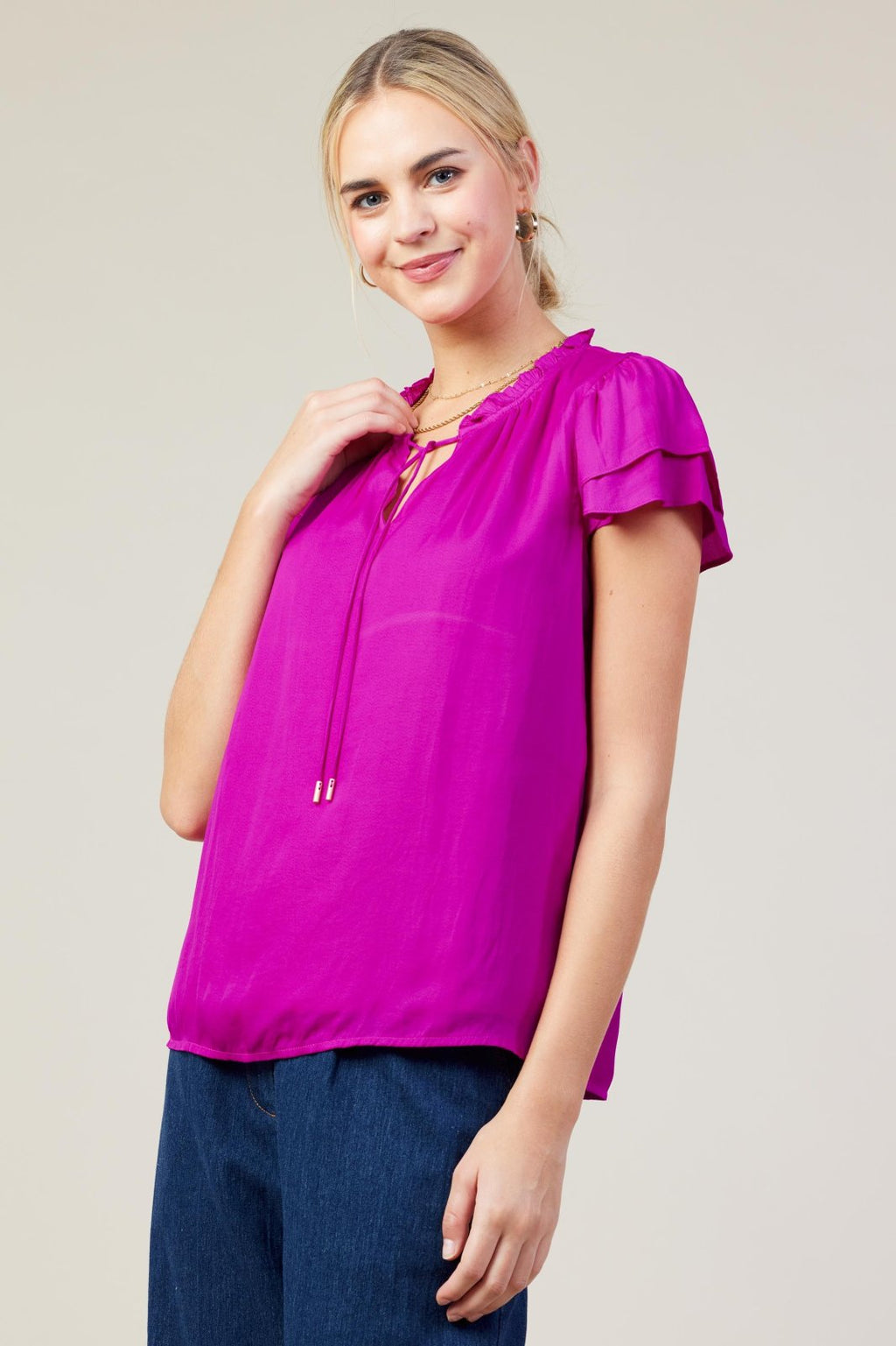 ORCHID SATIN RUFFLE TOP worn by model, showcasing trendy coastal style from Raggdoll Boutique, perfect for summer outfits Texas.