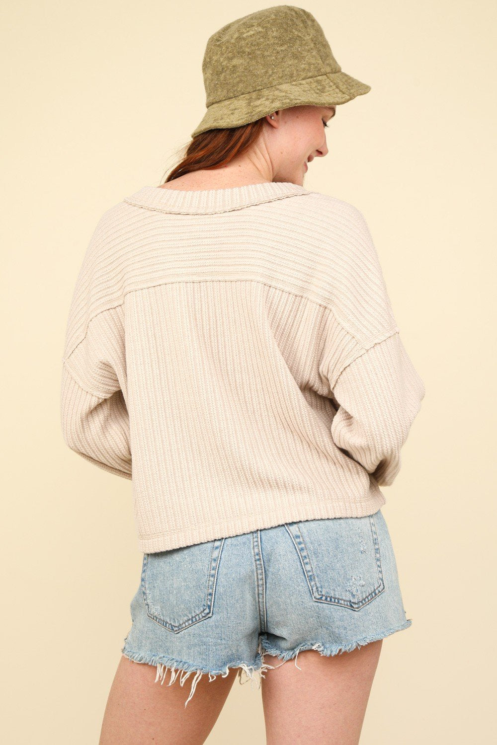 Casual oatmeal v-neck top paired with shorts, ideal for coastal boutique clothing and early fall style.