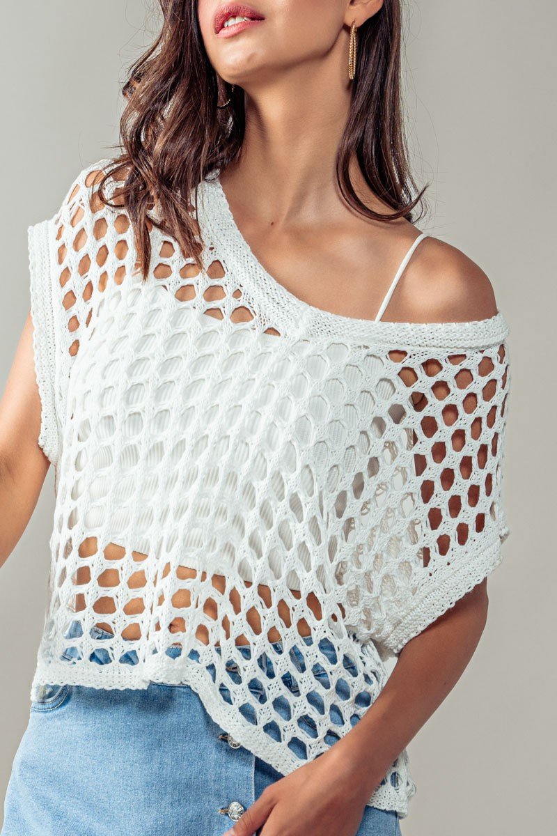 White crochet top from Raggdoll Boutique, perfect for summer outfits Texas and trendy coastal style.