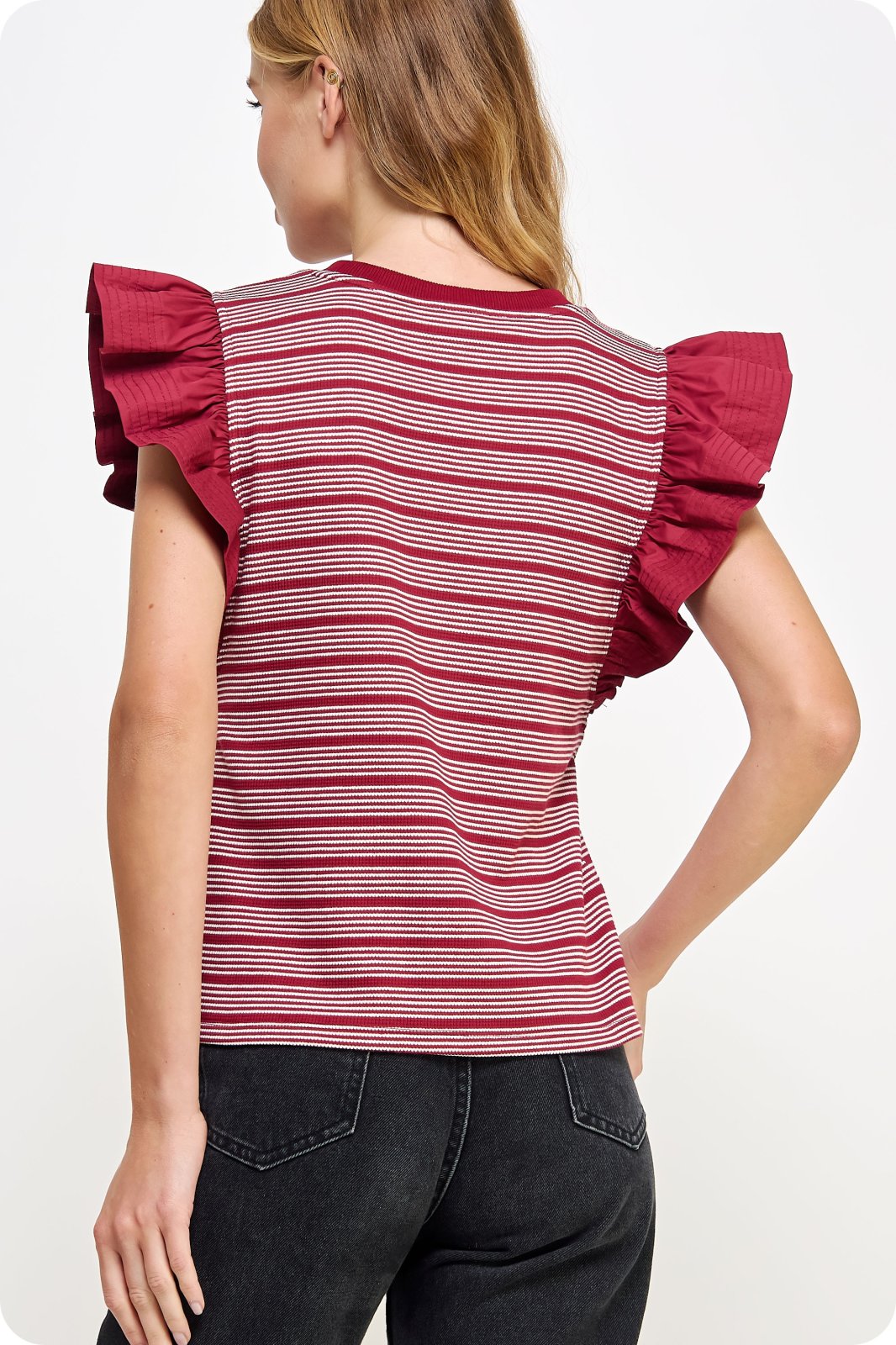Jodi Top from Raggdoll Boutique showcasing trendy coastal style with ruffled sleeves, perfect for summer outfits Texas.