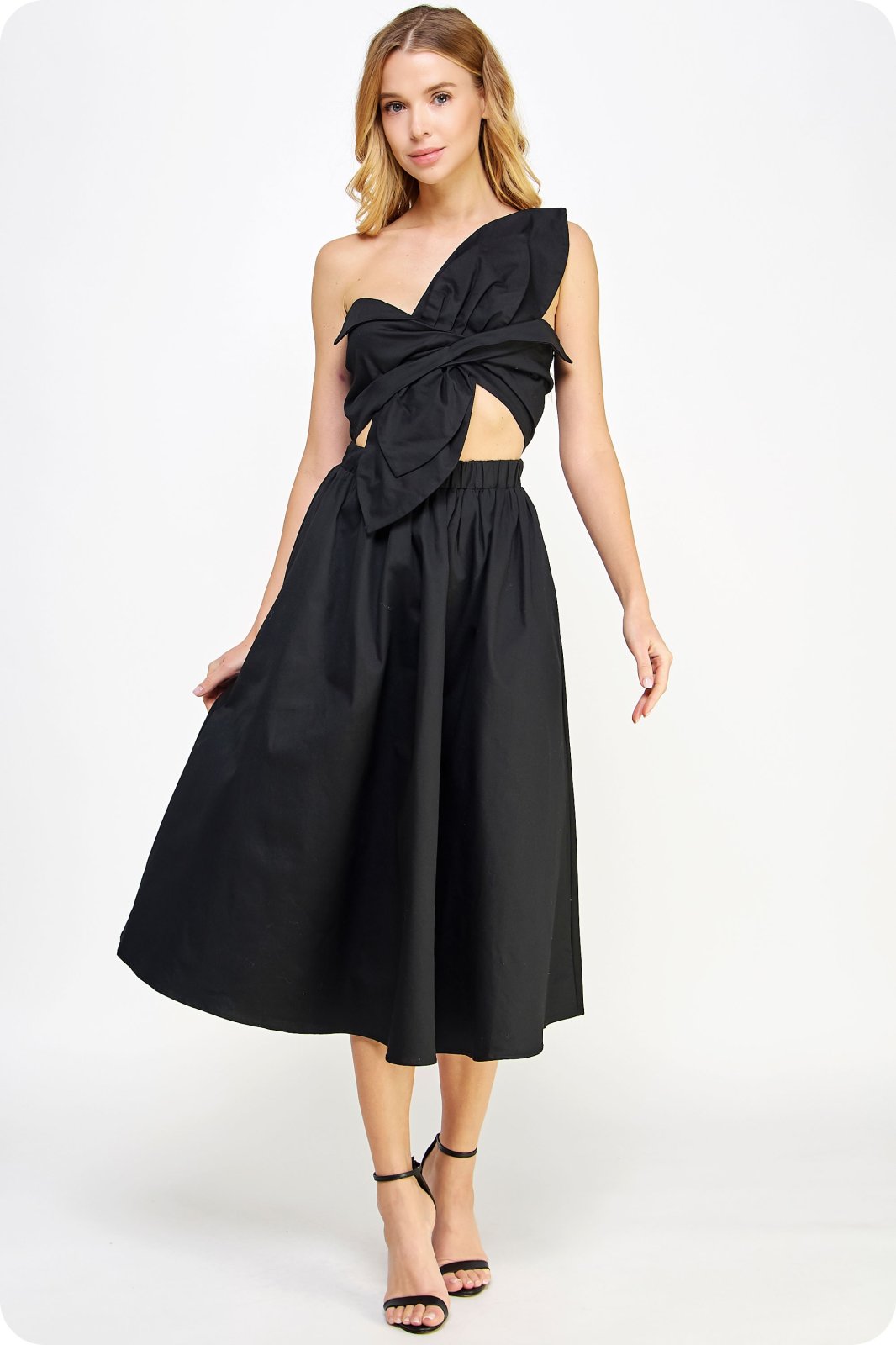 Sonya Dress by Raggdoll Boutique, a trendy coastal style midi dress with a twisted bow and adjustable strap.