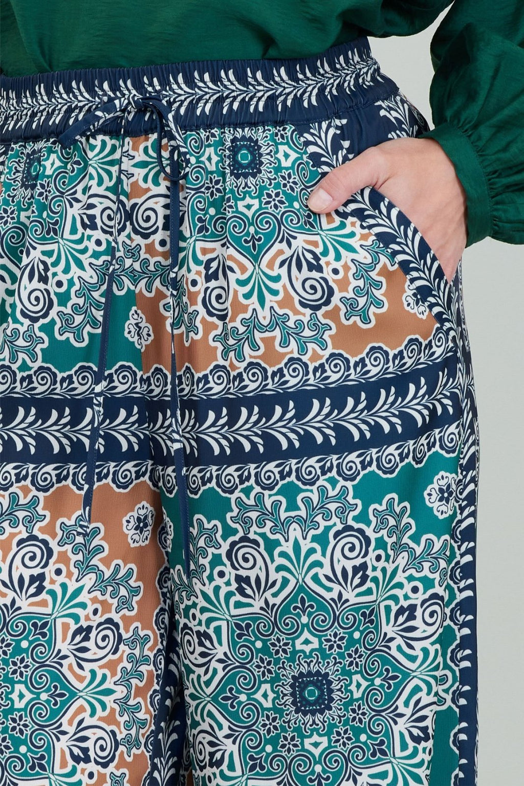 Colorful jewel-tone pants with an elastic waistband, perfect for coastal boutique clothing and stylish women's bottoms.