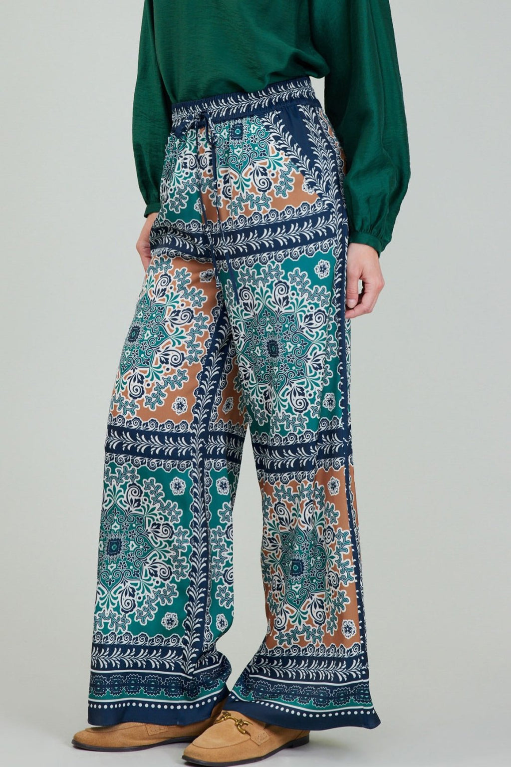 Jewel-tone pants featuring a vibrant print, perfect for coastal boutique clothing and curated women's fashion.