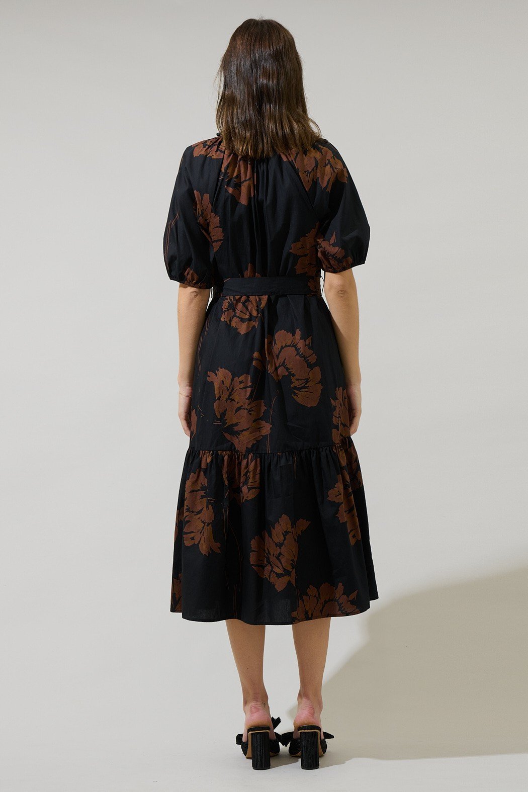 Celina Floral Wynette Tiered Midi Dress from a coastal boutique, stylish with puff sleeves and side pockets, ideal for vacations.