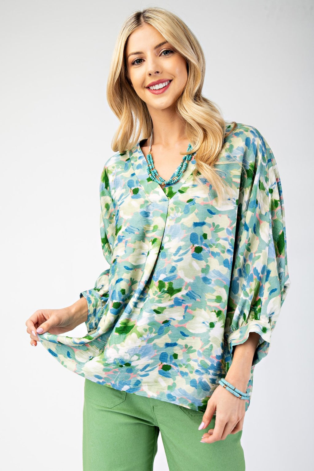 Stylish teal, pink, and green top perfect for coastal boutique clothing, beach dresses, and Port Aransas boutique. Ideal for tropical vacations.