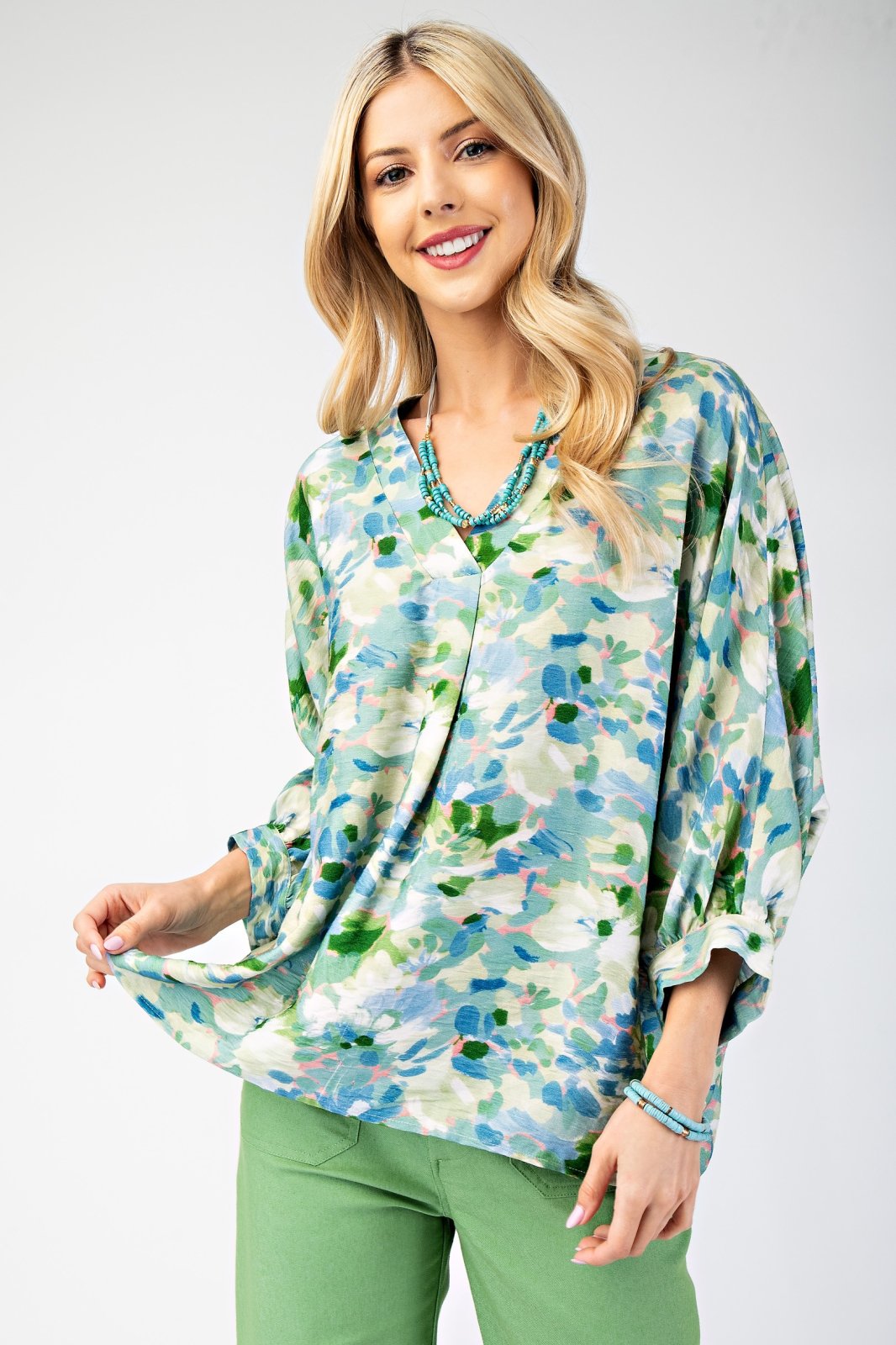 Stylish teal, pink, and green top perfect for coastal boutique clothing, beach dresses, and Port Aransas boutique. Ideal for tropical vacations.