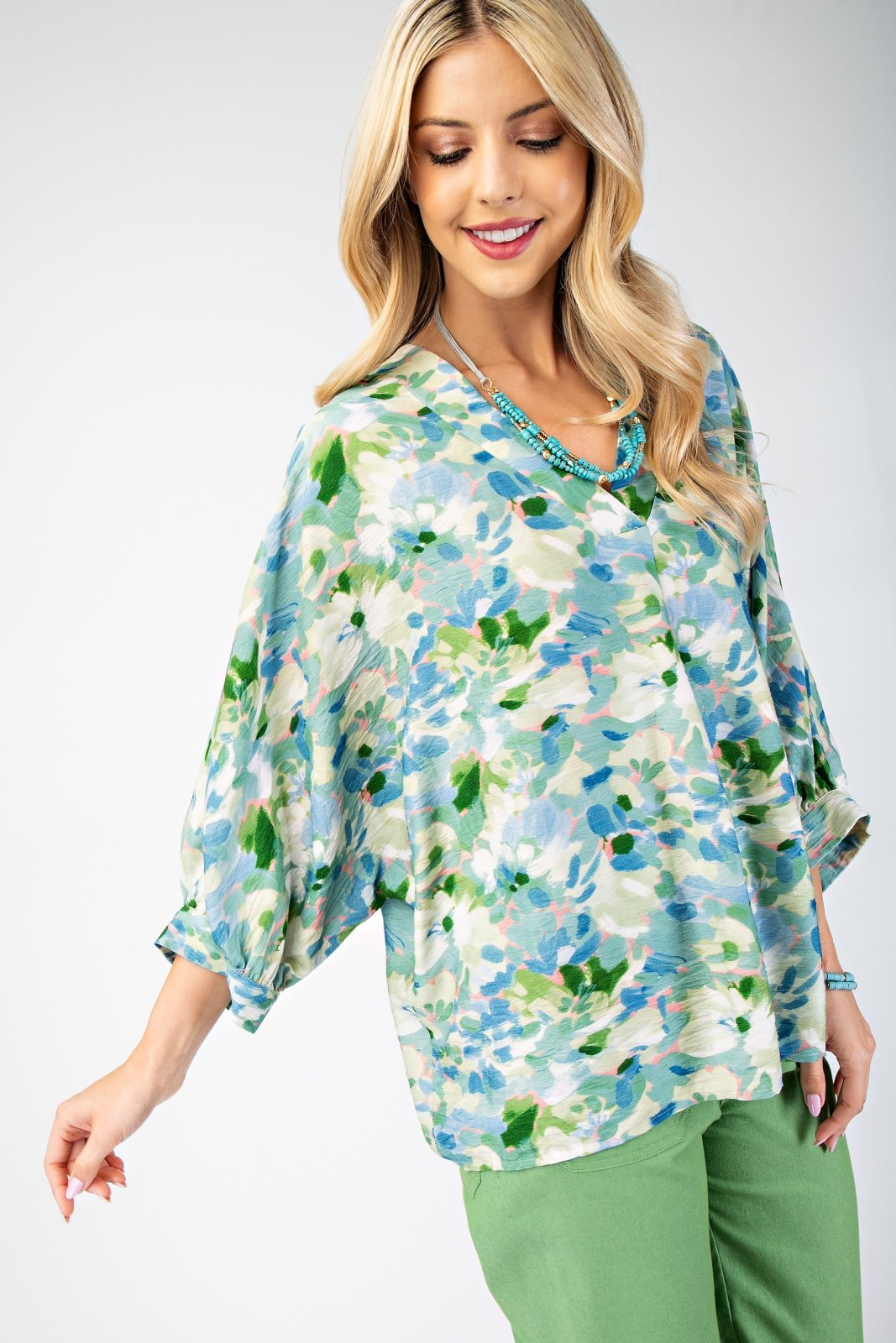 Teal, pink, and green stylish top for women, perfect for coastal boutique clothing and tropical vacations.
