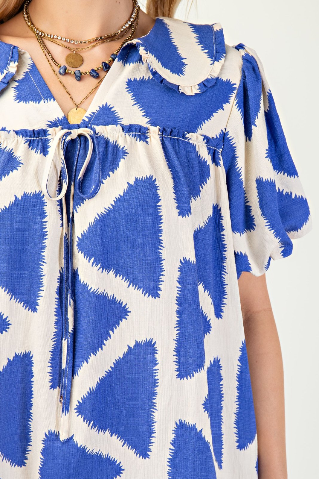 Blue Iris Mini Dress with bold blue triangle patterns, perfect for coastal boutique clothing and tropical vacation outfits.