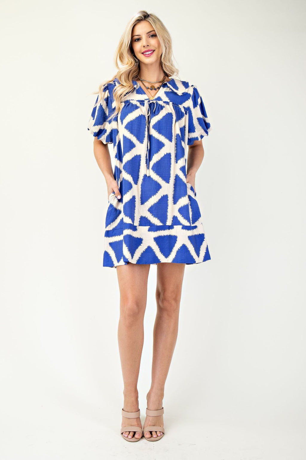 Blue Iris Mini Dress from coastal boutique, perfect for beach outings and tropical vacations. Stylish and comfortable women's fashion.