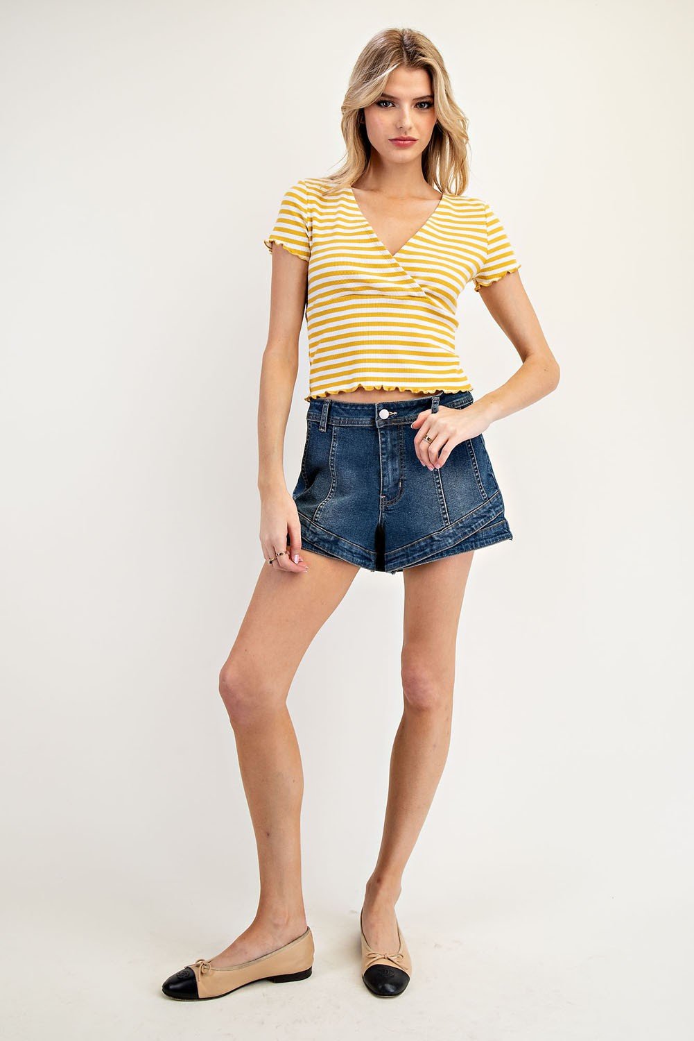 Mustard striped short-sleeve top with scalloped hem, styled for coastal boutique clothing and curvy plus size fashion.