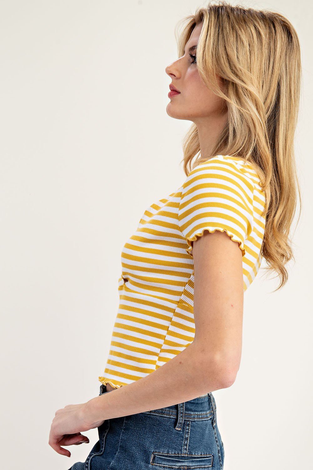Mustard striped short-sleeve top with scalloped details, ideal for coastal boutique clothing and stylish women's fashion.