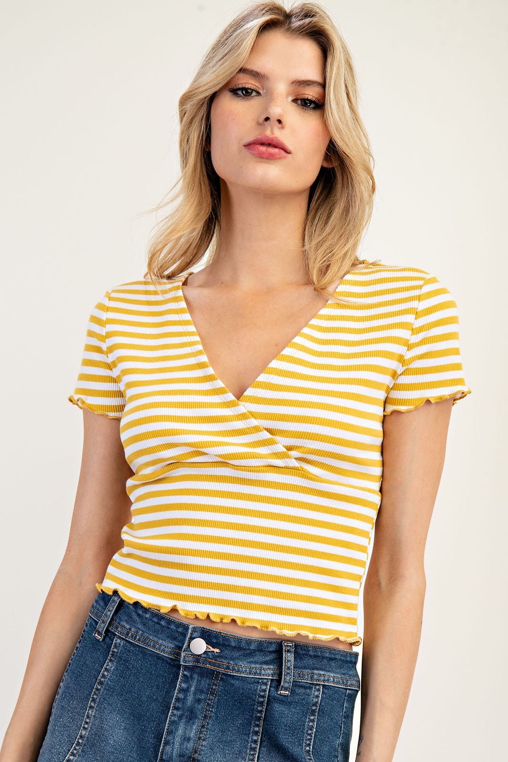 Stylish mustard striped short-sleeve top with scalloped cuffs, perfect for coastal boutique clothing and beach dresses.