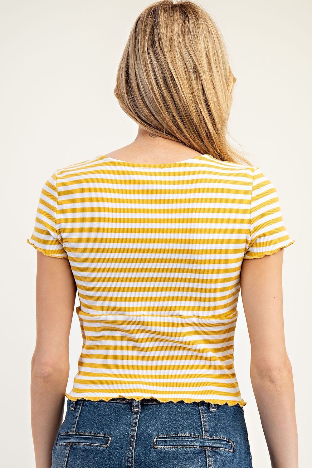 Back view of a mustard striped short-sleeve top with scalloped hem, perfect for coastal boutique clothing or curvy plus size fashion.